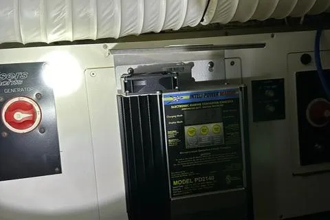 Slide: The Image of 2008 Cruisers Yachts 360 Express engine room with electronic marine converter charger. - 29