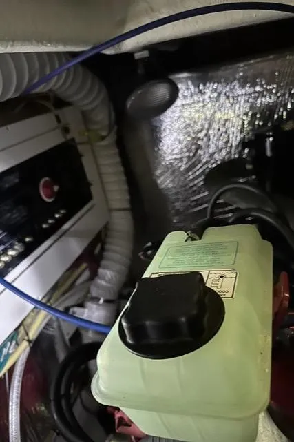 Slide: The Image of Engine compartment of 2008 Cruisers Yachts 360 Express with visible wiring and components. - 31