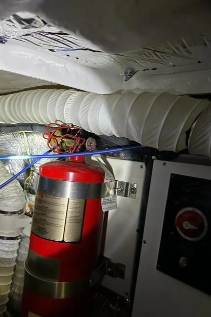 Slide: The Image of Engine room of 2008 Cruisers Yachts 360 Express with fire extinguisher and ventilation ducts. - 32