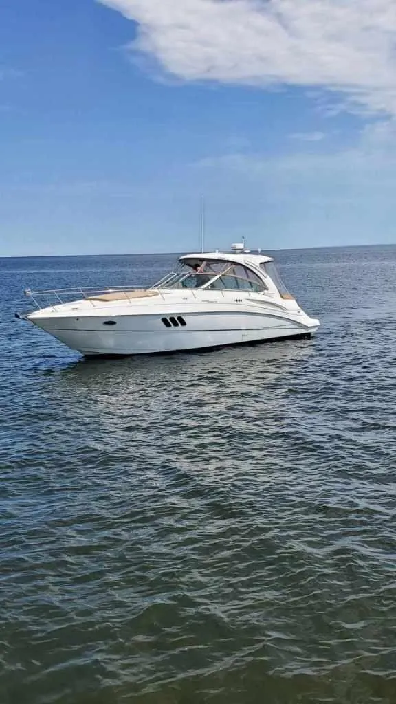Slide: The Image of 2008 Cruisers Yachts 360 Express on calm sea under blue sky. - 5