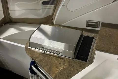 Slide: The Image of 2008 Cruisers Yachts 360 Express interior with built-in grill on countertop. - 7