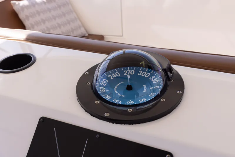 Slide: The Image of Compass on 1987 Ocean Yachts Convertible boat dashboard. - 21