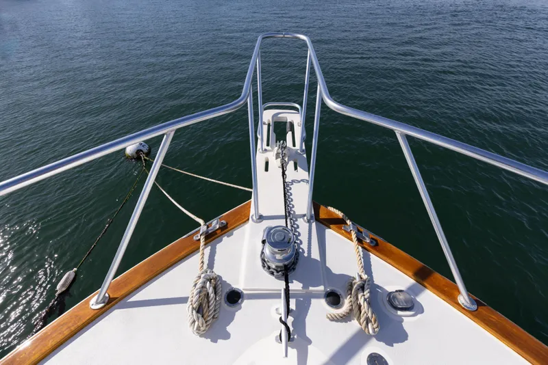 Slide: The Image of Bow view of 1987 Ocean Yachts Convertible on calm water. - 26