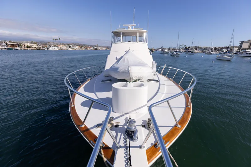 Slide: The Image of 1987 Ocean Yachts Convertible on calm water, showcasing sleek design and spacious deck. - 27