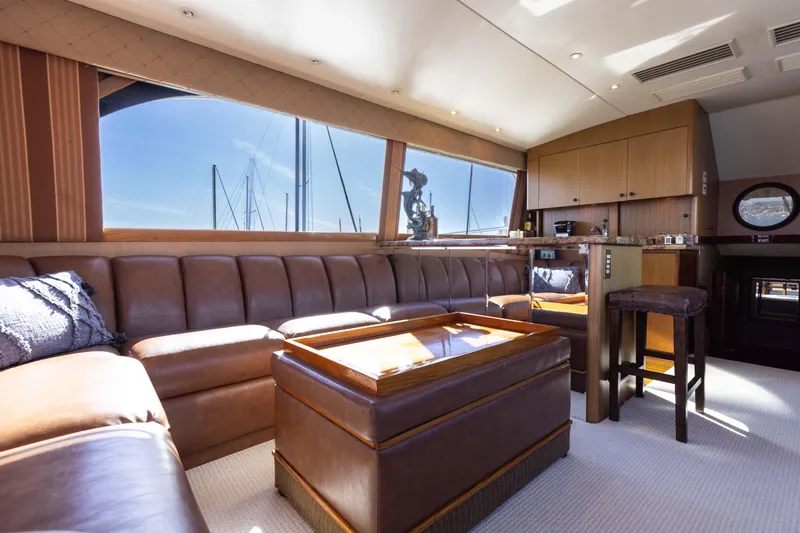Slide: The Image of Luxurious interior of a 1987 Ocean Yachts Convertible with leather seating and wooden accents. - 5
