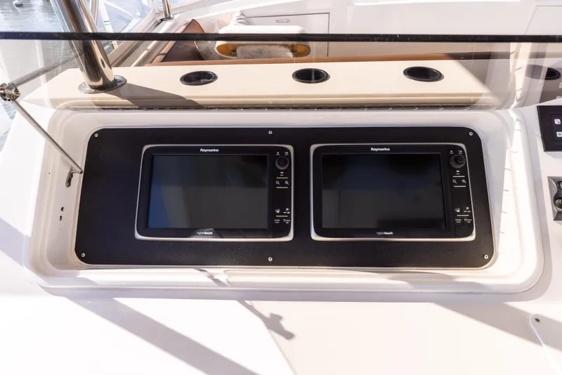 Slide: The Image of 1987 Ocean Yachts Convertible dashboard with dual navigation screens. - 22