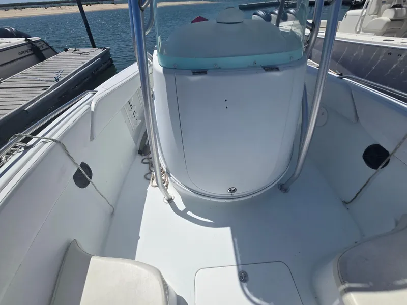 Slide: The Image of 2004 Baja 250 Sportfish boat interior at dock, featuring spacious seating and sleek design. - 3