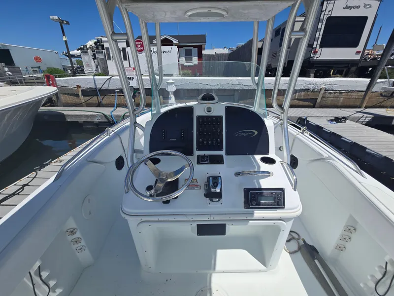 Slide: The Image of 2004 Baja 250 Sportfish boat cockpit with steering wheel and control panel. - 4