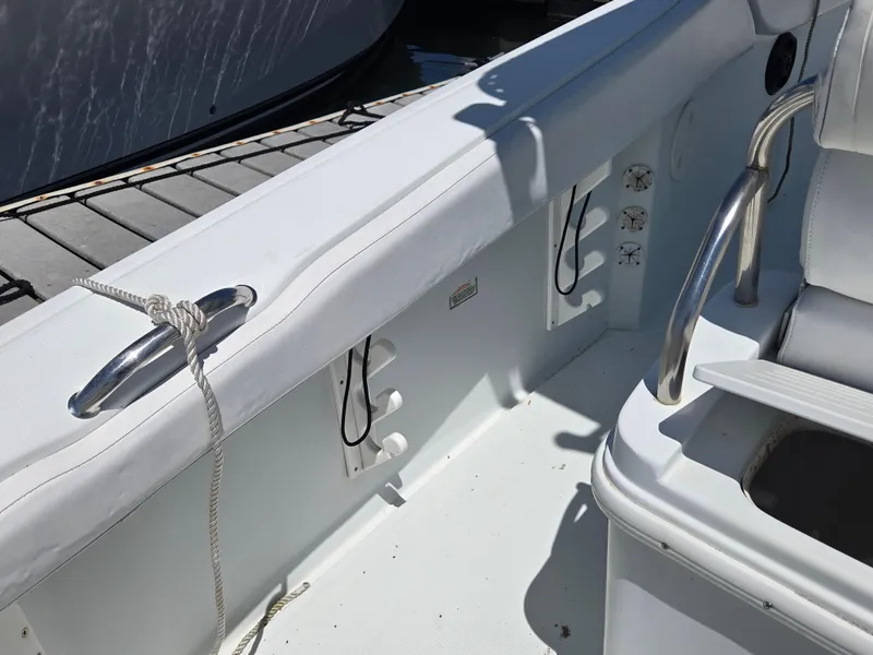 Slide: The Image of 2004 Baja 250 Sportfish boat interior with cleat and seating area. - 8