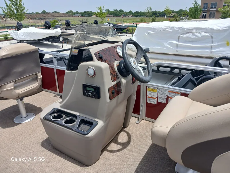 Slide: The Image of 2023 Sun Tracker 18BASSBUGGY boat interior with steering console and seating. - 5