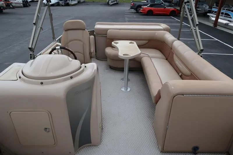 Slide: The Image of 2008 Godfrey SAN PAN 2500 RE pontoon boat with beige seating and steering console. - 10