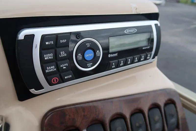 Slide: The Image of Jensen audio system on 2008 Godfrey SAN PAN 2500 RE boat dashboard. - 16