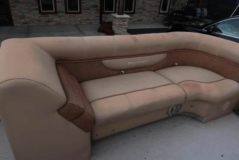 Slide: The Image of 2008 Godfrey SAN PAN 2500 RE boat seating, beige upholstery, outdoor setting. - 9