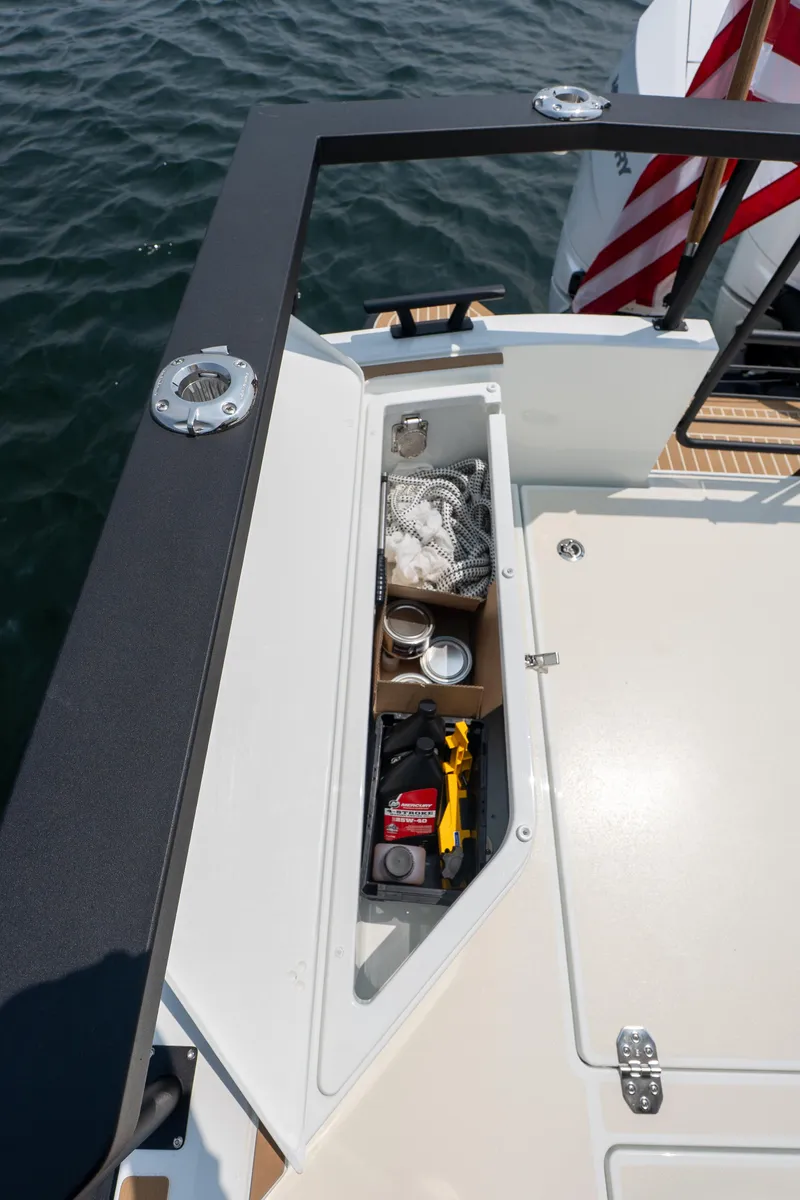 Slide: The Image of Storage compartment on 2025 Targa 32 GT boat, featuring various marine equipment. - 11
