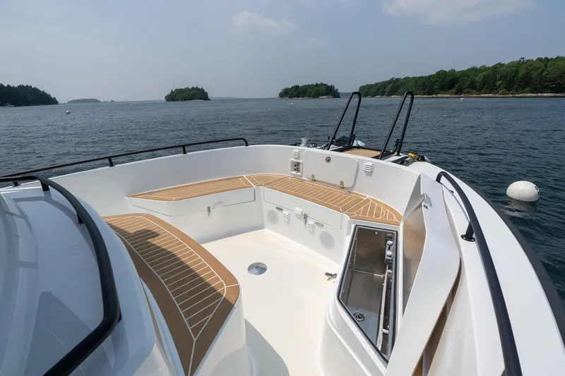 Slide: The Image of 2025 Targa 32 GT boat with spacious deck, scenic water view, and modern design. - 21