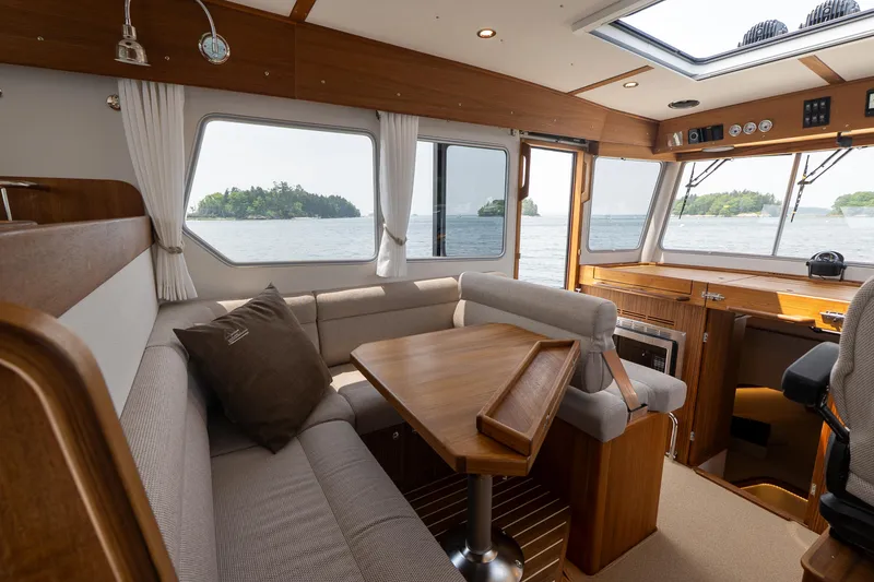 Slide: The Image of Interior of 2025 Targa 32 GT boat with cozy seating and ocean view. - 30