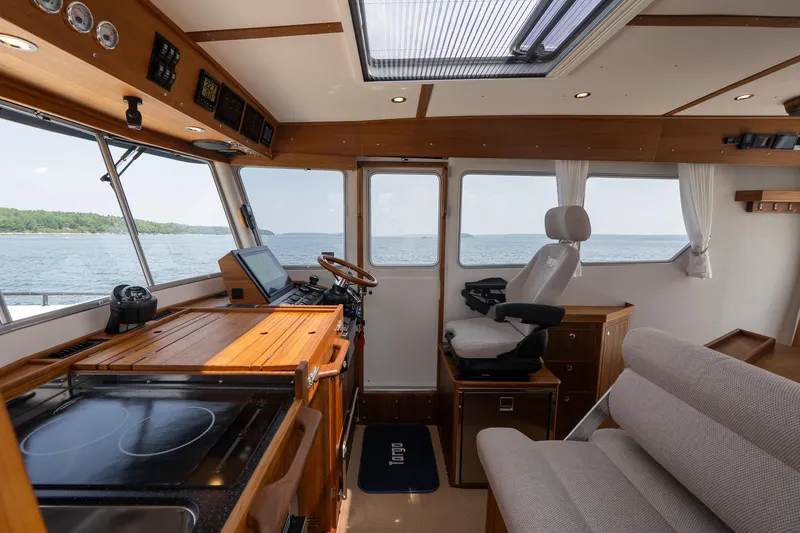 Slide: The Image of Interior of 2025 Targa 32 GT boat with modern helm and seating. - 36