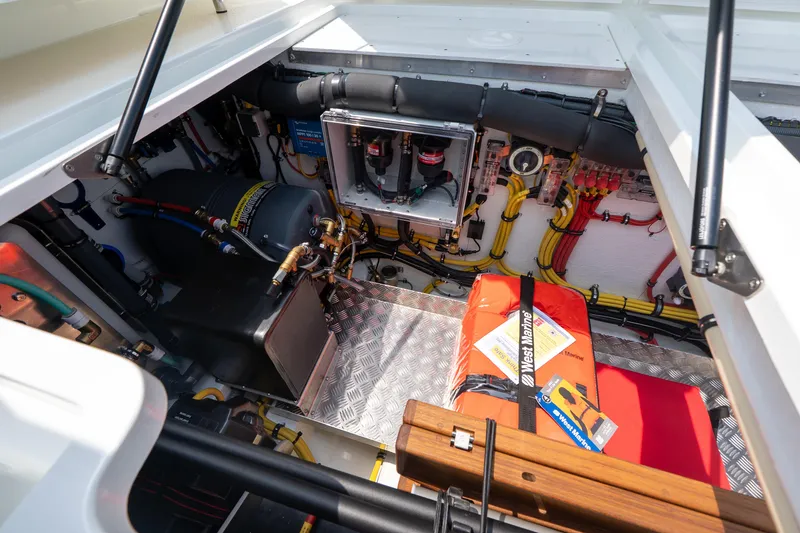 Slide: The Image of Engine compartment of 2025 Targa 32 GT boat, showcasing mechanical components and wiring. - 9