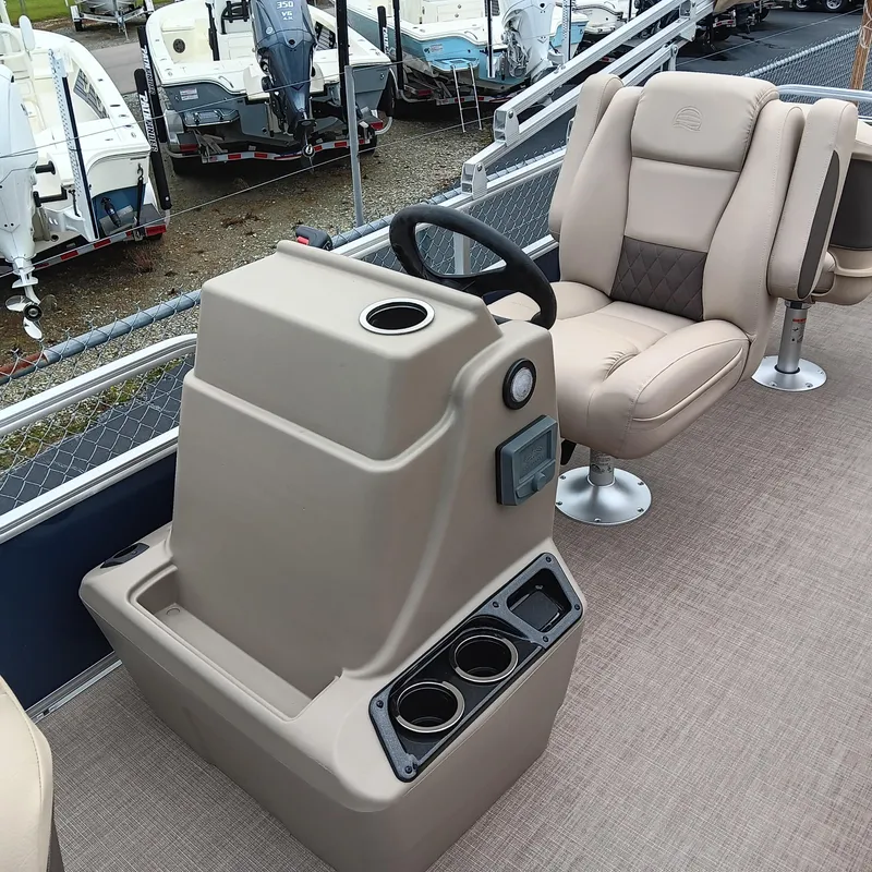 Slide: The Image of 2025 Sun Tracker Bass Buggy 18 DLX interior with steering console and comfortable seating. - 13