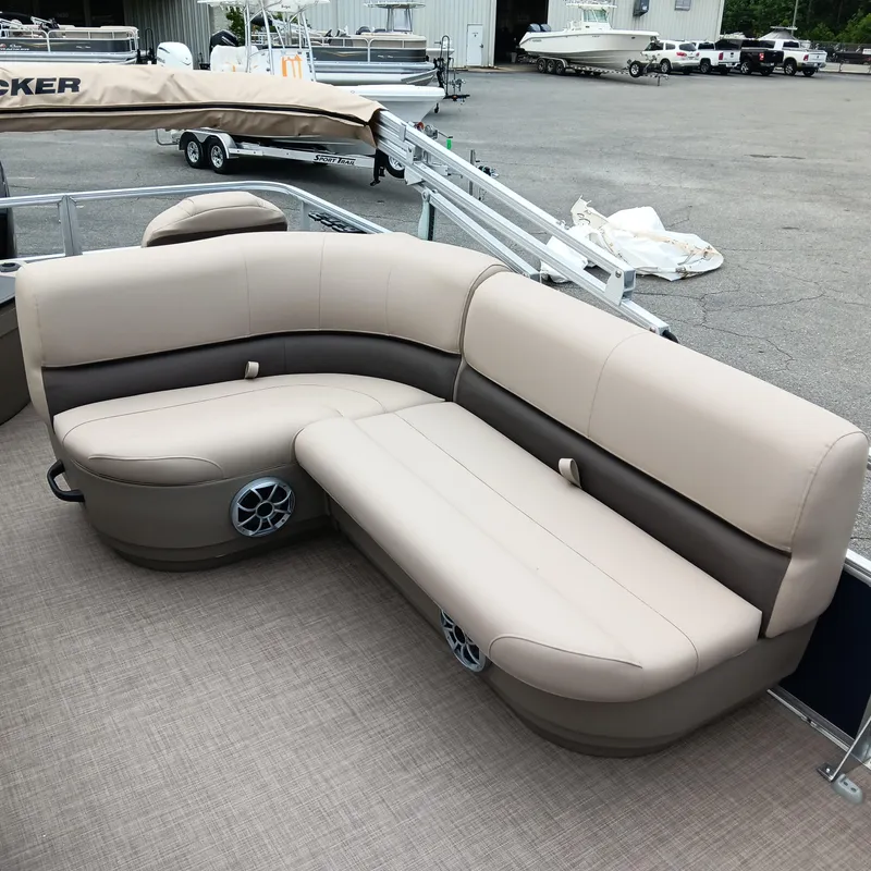 Slide: The Image of 2025 Sun Tracker Bass Buggy 18 DLX pontoon boat with beige seating and speakers. - 15