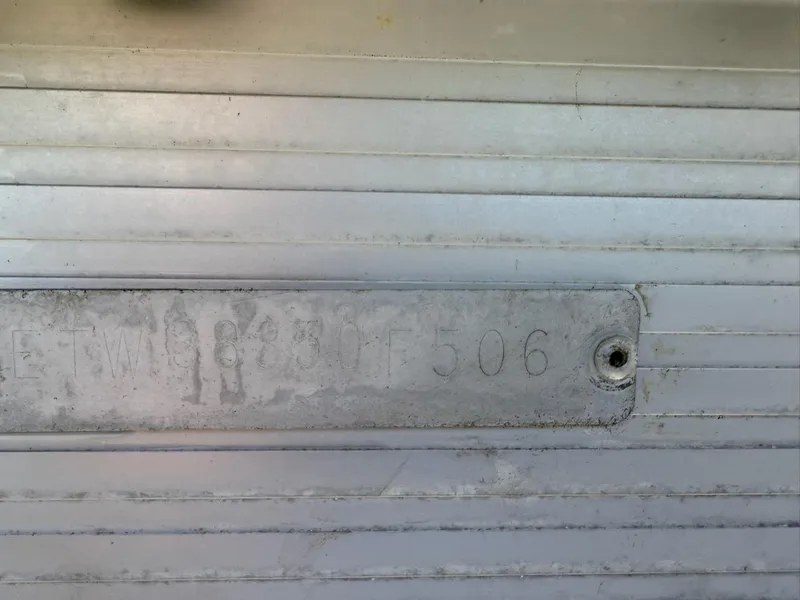 Slide: The Image of Hull identification number on a 2006 Bennington 2575 RFS - IO boat. - 15