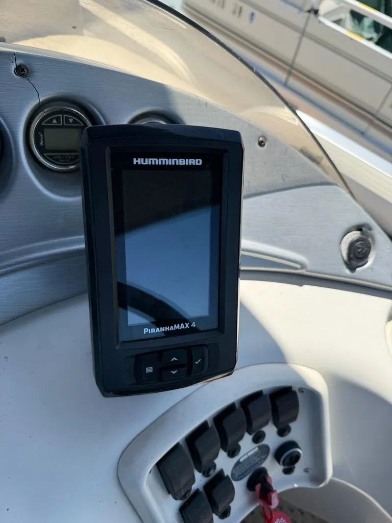 Slide: The Image of Humminbird PiranhaMAX 4 fish finder on 2006 Bennington 2575 RFS - IO boat dashboard. - 8