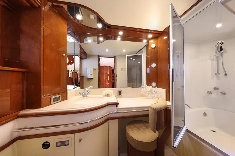 Slide: The Image of Luxurious bathroom interior of 2007 Marquis 65 yacht with elegant wood finishes and modern fixtures. - 13
