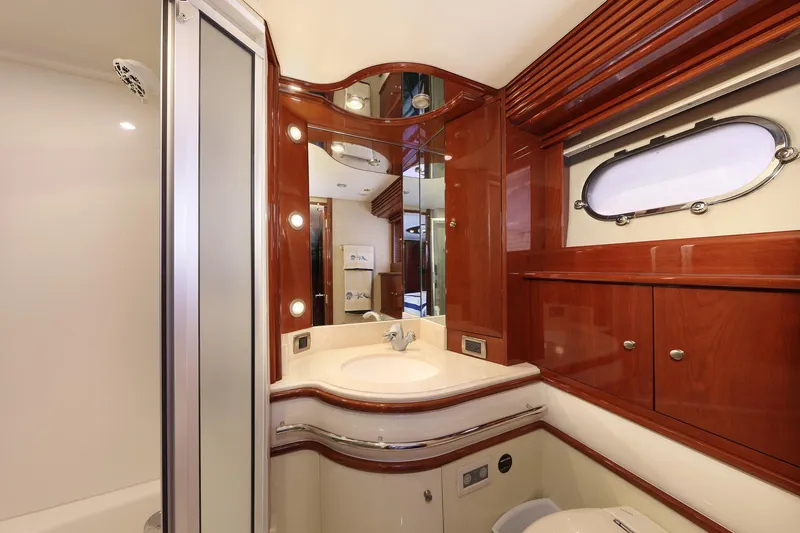 Slide: The Image of Luxurious 2007 Marquis 65 yacht bathroom with elegant wood finishes and modern fixtures. - 14