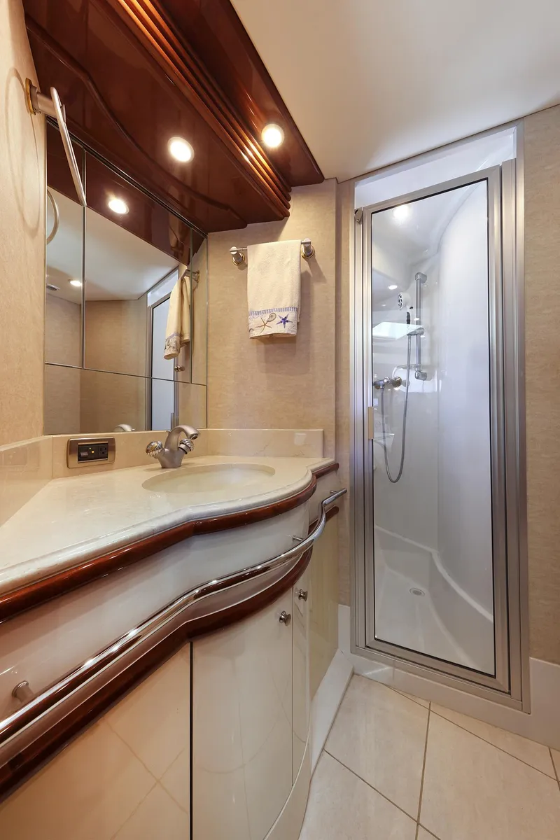 Slide: The Image of Luxurious bathroom in 2007 Marquis 65 yacht with modern fixtures and elegant design. - 17