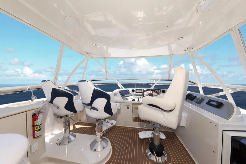 Slide: The Image of Luxurious 2007 Marquis 65 yacht helm with ocean view and modern seating. - 20
