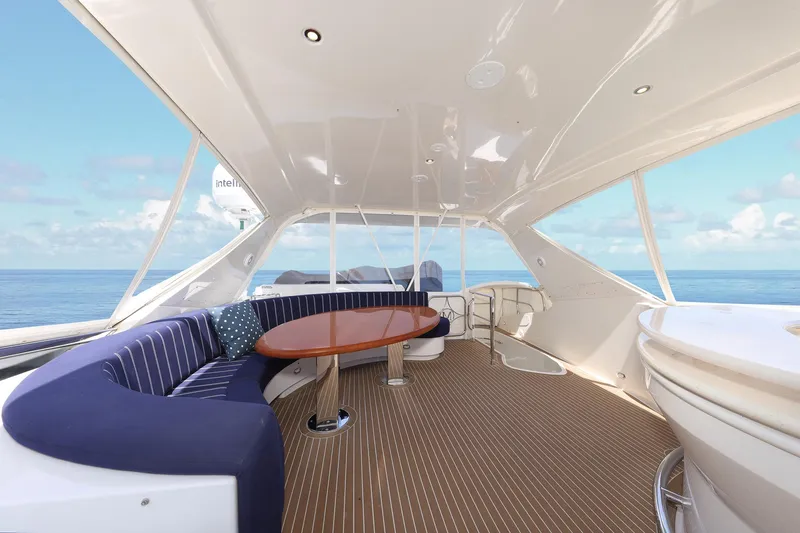 Slide: The Image of Luxurious 2007 Marquis 65 yacht deck with elegant seating and ocean view. - 21