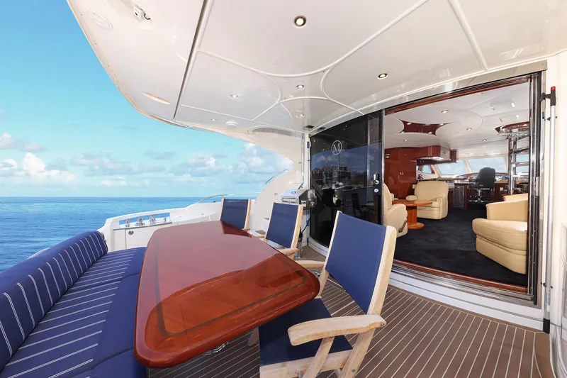 Slide: The Image of Luxurious 2007 Marquis 65 yacht with elegant outdoor seating and ocean view. - 22