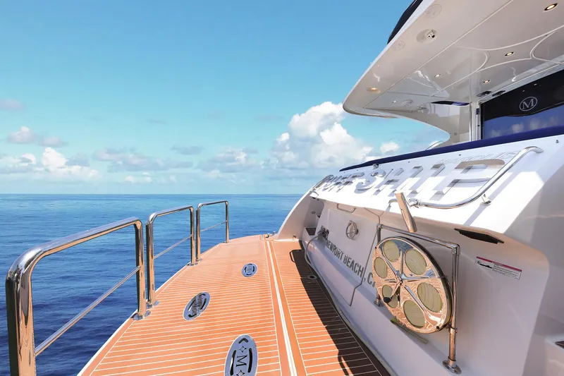 Slide: The Image of Luxurious 2007 Marquis 65 yacht deck with ocean view and clear blue sky. - 23