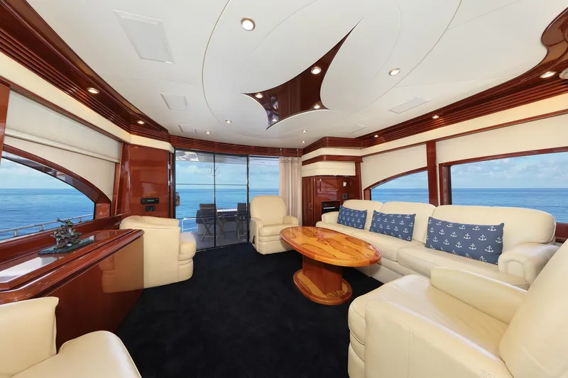 Slide: The Image of Luxurious interior of a 2007 Marquis 65 yacht with elegant seating and ocean view. - 3