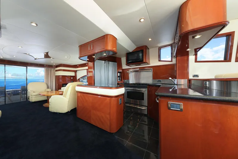 Slide: The Image of Luxurious interior of a 2007 Marquis 65 yacht with modern kitchen and ocean view. - 5