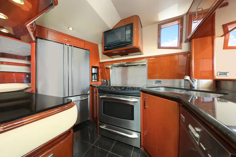Slide: The Image of Luxurious kitchen interior of 2007 Marquis 65 yacht with modern appliances and sleek design. - 6
