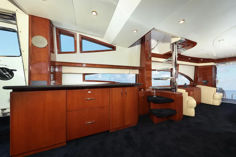 Slide: The Image of Luxurious interior of a 2007 Marquis 65 yacht with elegant wood finishes and modern design. - 7