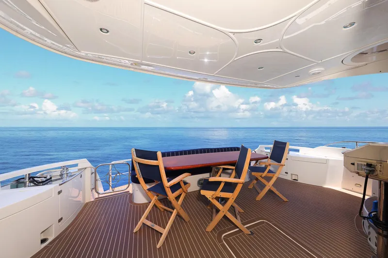 Slide: The Image of Luxurious 2007 Marquis 65 yacht deck with ocean view and seating area. - 8