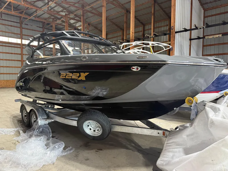 Slide: The Image of 2025 Yamaha Boats 222XD on trailer in storage facility. - 0