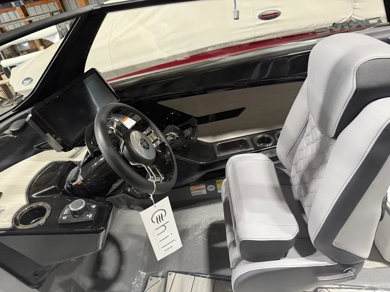 Slide: The Image of 2025 Yamaha Boats 222XD cockpit with modern steering and plush seating. - 5