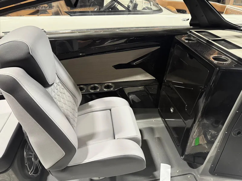 Slide: The Image of 2025 Yamaha Boats 222XD interior with sleek seating and modern console design. - 6