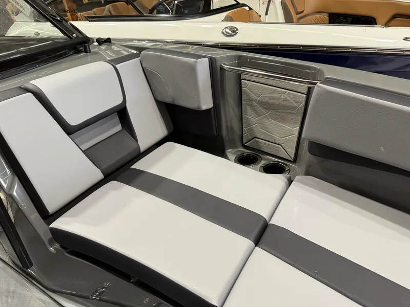 Slide: The Image of 2025 Yamaha Boats 222XD interior seating with modern design and cup holders. - 7