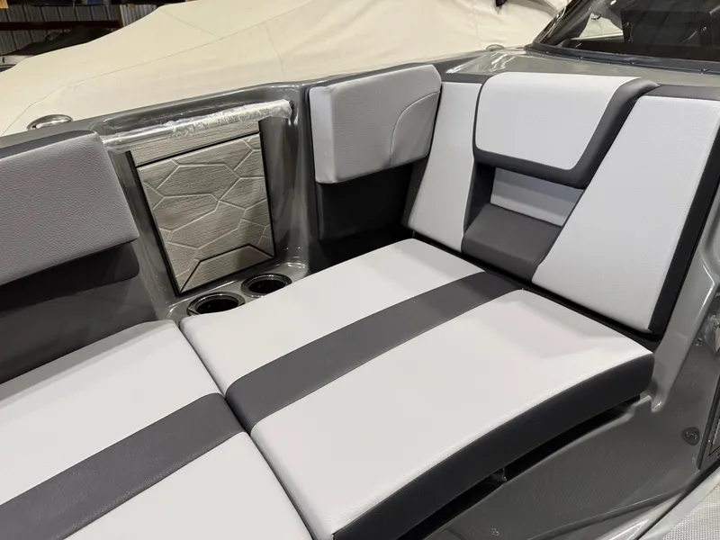Slide: The Image of 2025 Yamaha Boats 222XD interior with modern gray and white seating, featuring cup holders. - 9