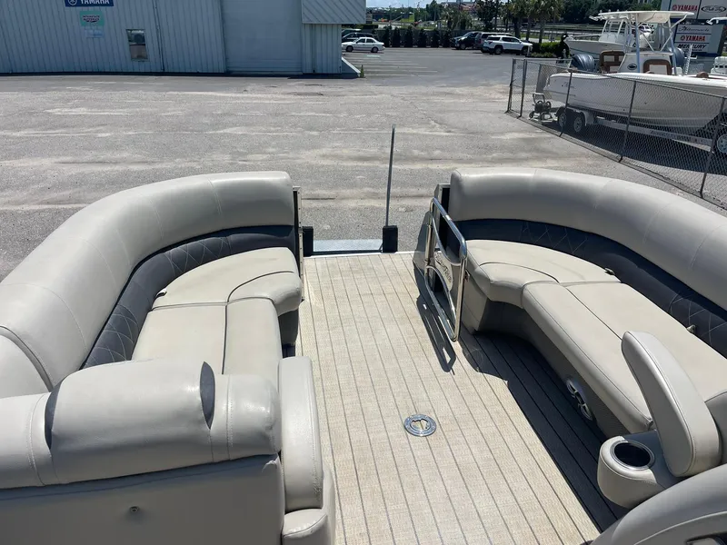 Slide: The Image of 2020 Silver Wave 2210 SW5 L pontoon boat interior with beige seating and spacious deck. - 10