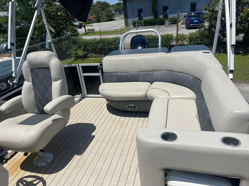 Slide: The Image of 2020 Silver Wave 2210 SW5 L pontoon boat with beige seating and spacious deck. - 11