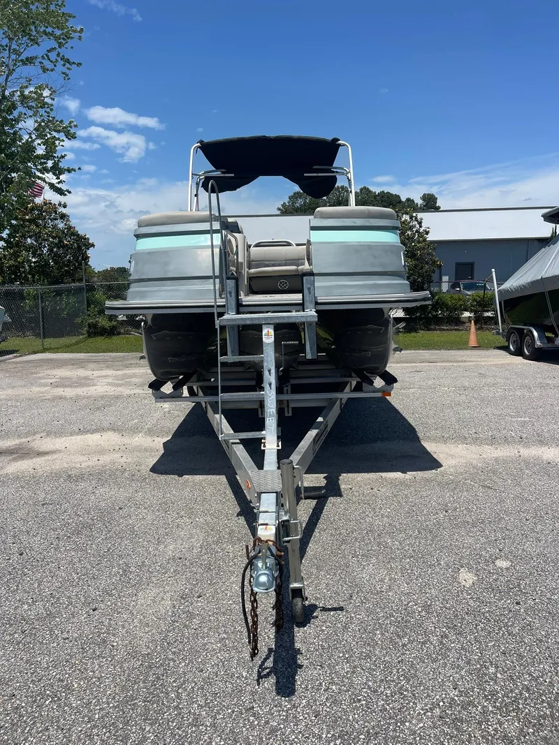 Slide: The Image of 2020 Silver Wave 2210 SW5 L pontoon boat on trailer, parked outdoors. - 5
