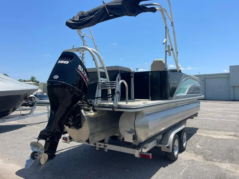 Slide: The Image of 2020 Silver Wave 2210 SW5 L pontoon boat with Suzuki outboard motor on trailer. - 6