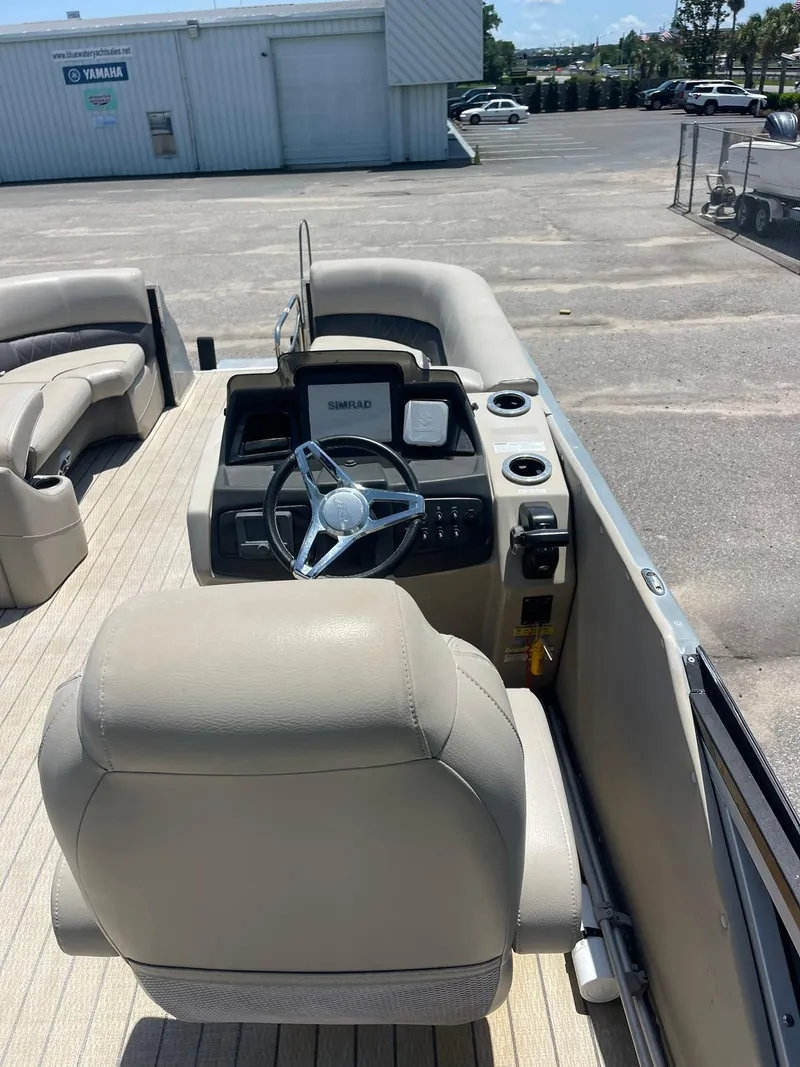 Slide: The Image of 2020 Silver Wave 2210 SW5 L boat interior with steering console and seating. - 8