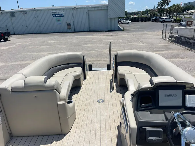 Slide: The Image of 2020 Silver Wave 2210 SW5 L pontoon boat with beige seating and modern dashboard. - 9