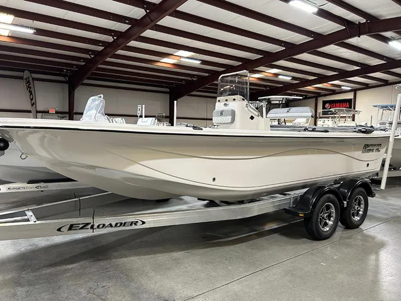 Slide: The Image of 2025 Carolina Skiff 21 LS boat on EZ Loader trailer in showroom. - 0